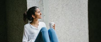 Person smiling and reflecting.