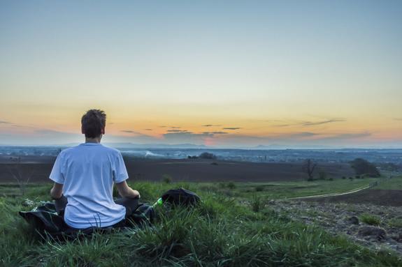 Person practicing mindfulness for spiritual growth