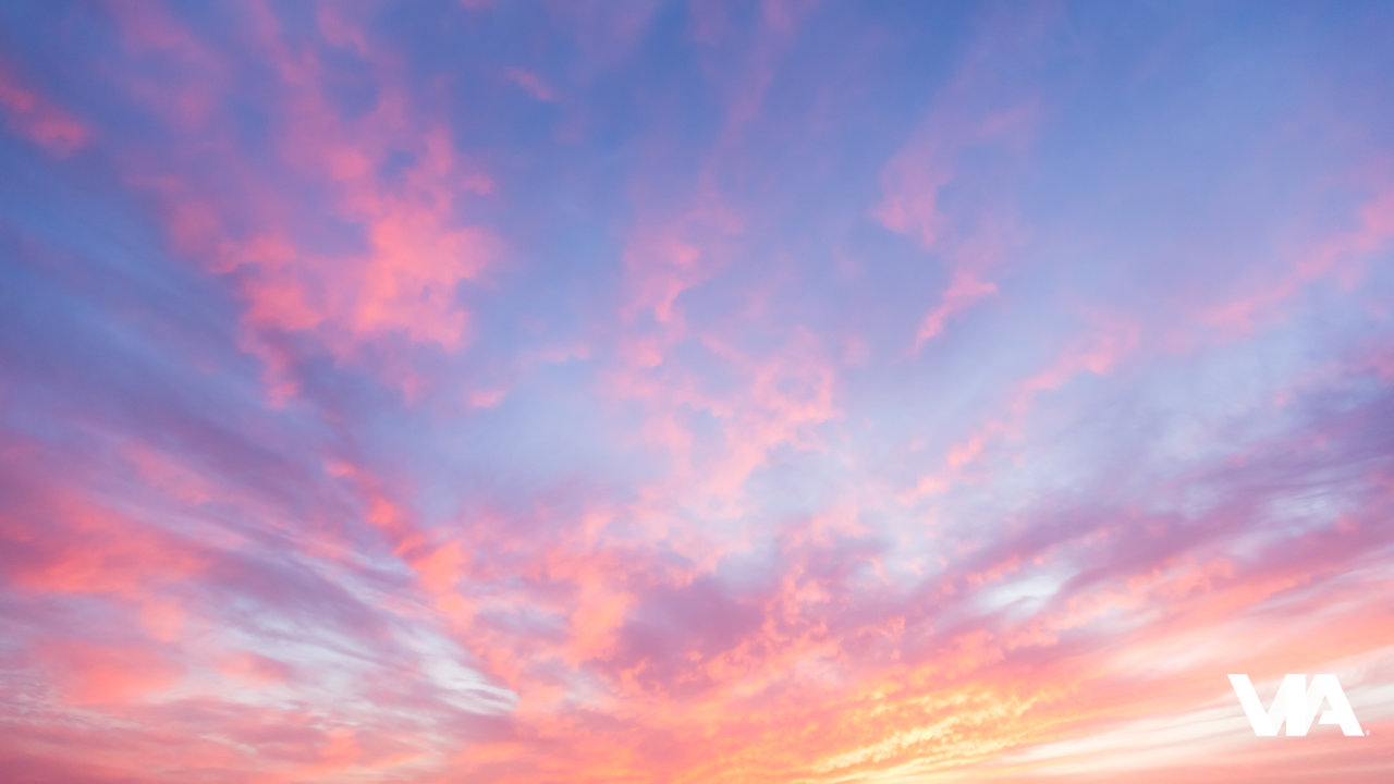 A calming sunset over a quiet horizon, symbolizing the pause and presence that mindfulness and meditation can bring to your day.